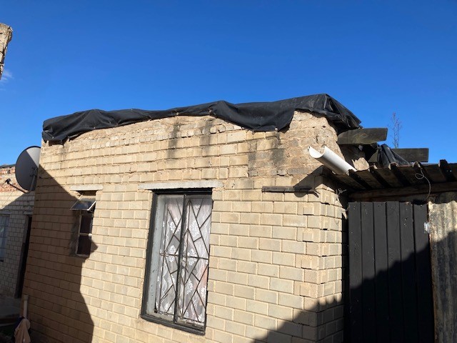 Raising the roof: Pastor Matiti needed a new roof Raising the roof: Pastor Matiti needed a new roof