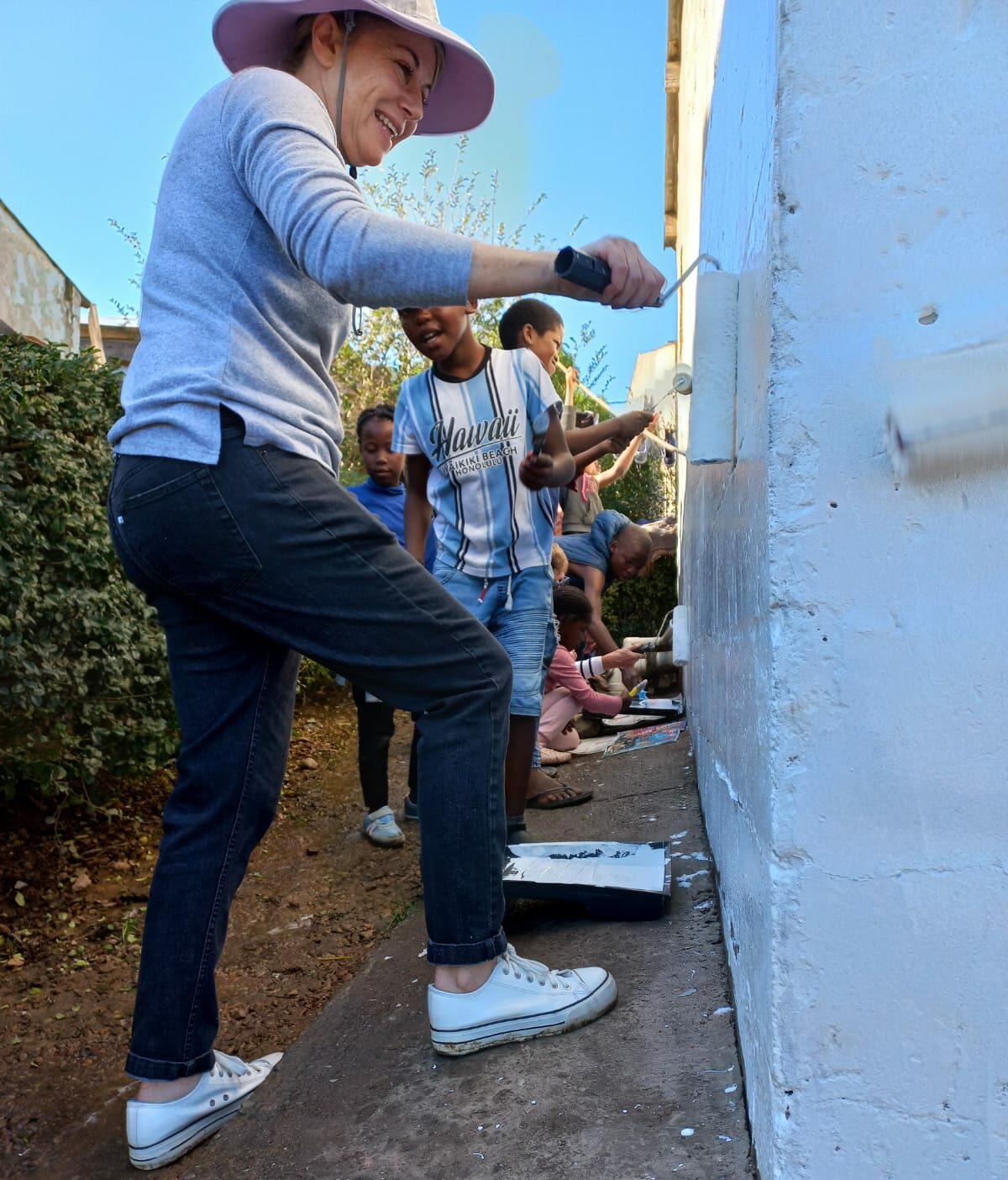 together we serve_Ancel and kids painting