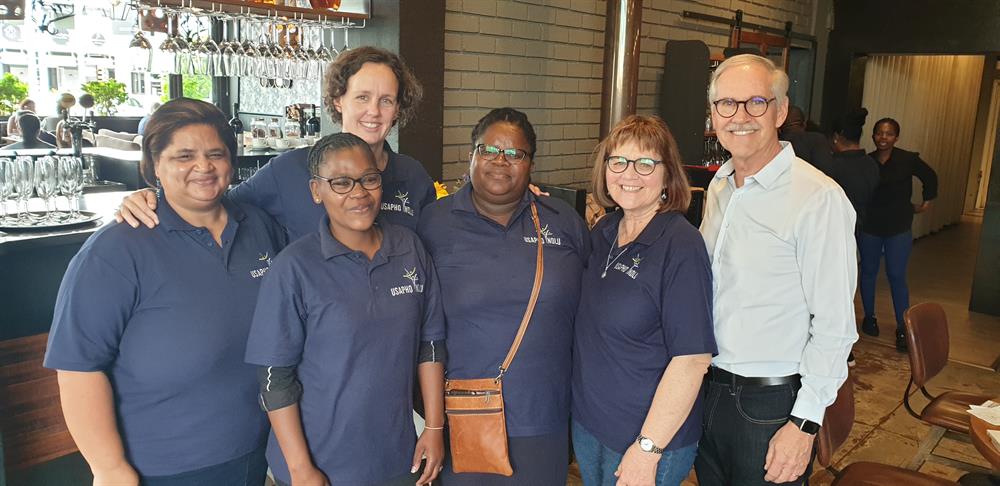 Brett Johnson, founder of the Institute for Innovation, Integration and Impact, with volunteers and staff of Usapho Indlu, from left: Natalie Mentoor, Siphokazi Manangana, Andrea Moss, Neziswa Matiso and founder and director Sally Versfeld.